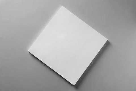 Stack of blank paper sheets for brochure on light grey background, top view Stock Photos