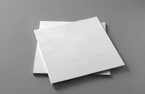 Stack of blank paper sheets for brochure on light grey background Stock Photos