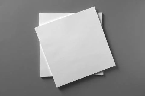 Stack of blank paper sheets for brochure on light grey background, top view 스톡 사진