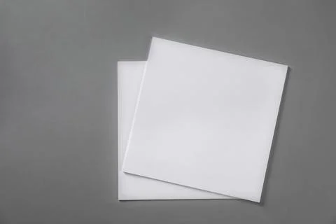 Stack of blank paper sheets for brochure on light grey background, top view 스톡 사진
