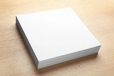 Stack of blank paper sheets for brochure on wooden background. Mock up 스톡 사진