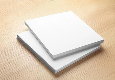 Stack of blank paper sheets for brochure on wooden background. Mock up 스톡 사진