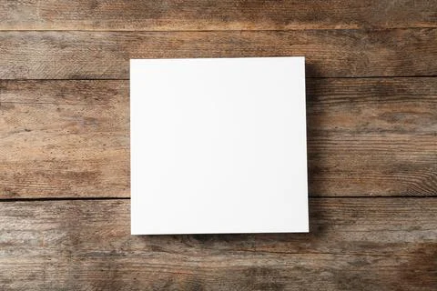 Stack of blank paper sheets for brochure on wooden background, top view. Mock 스톡 사진