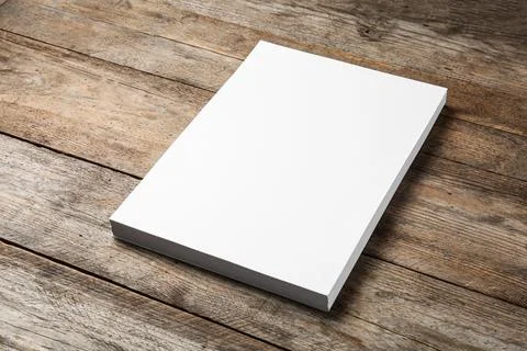 Stack of blank paper sheets for brochure on wooden background. Mock up Foto stock