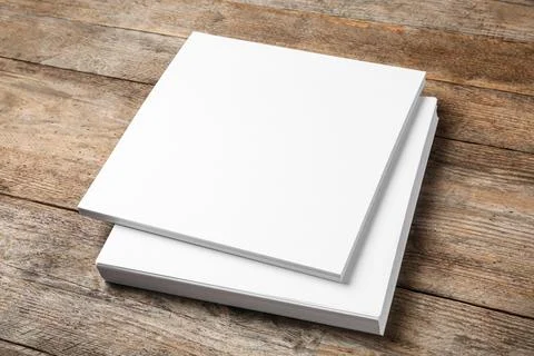 Stack of blank paper sheets for brochure on wooden background. Mock up 스톡 사진