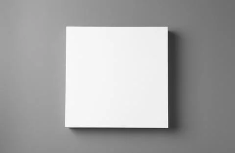 Stack of blank paper sheets for brochure on grey background, top view. Mock u Stockfoto's