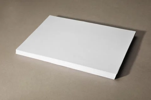 Stack of blank paper sheets on light brown background, space for text Foto stock