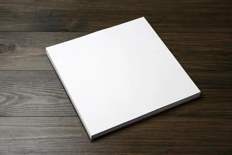 Stack of blank paper sheets on wooden table. Brochure design 스톡 사진