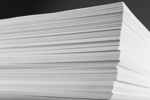 Stack of blank white paper on grey background, closeup Foto stock