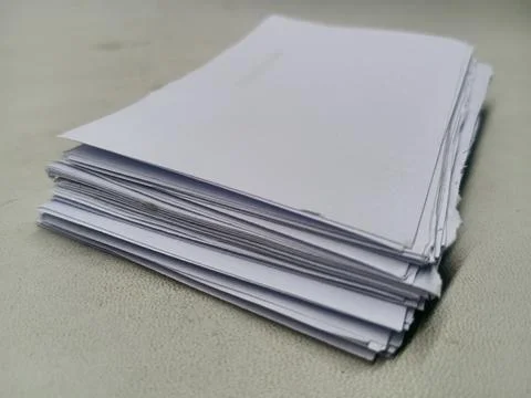 Stack of Blank White Paper Sheets on Textured Surface 写真素材