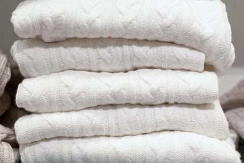 A stack of blankets. Clothing store. Retail trade. Consumerism Stock Photos