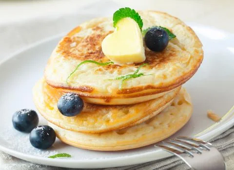 Stack of blinis or pancakes with blueberries Stock Photos