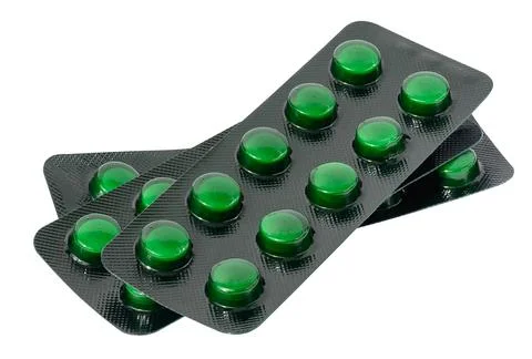 Stack of blister packs with round pills on a white isolated background Stock Photos
