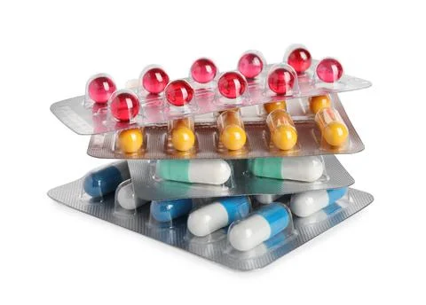 Stack of blisters with different pills on white background Stock Photos