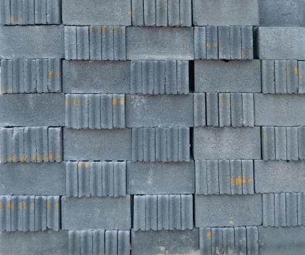 Stack of block bricks pattern texture background. Raw material for constructi Stock Photos