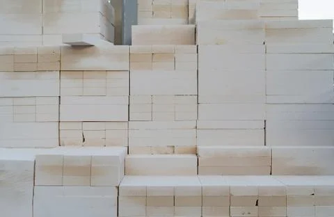 Stack of block bricks pattern texture background. Raw material for constructi Foto stock