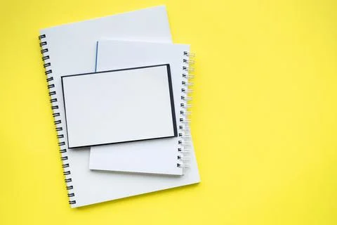 Stack of blocks and notebooks with spiral. Stock Photos