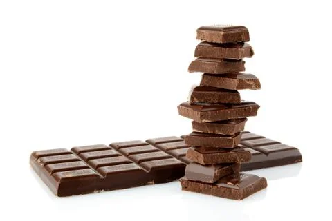 Stack of blocks of chocolates on white background Stock Photos