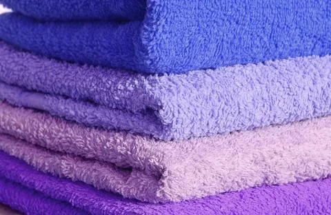 Stack of blue and purple towels Stock Photos
