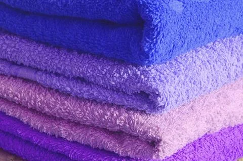 Stack of blue and purple towels Stock Photos