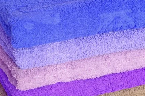 Stack of blue and purple towels Stock Photos