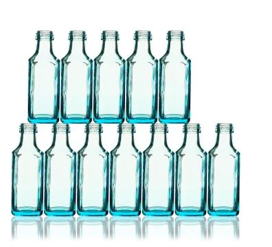 Stack of blue bottles back lit Foto stock