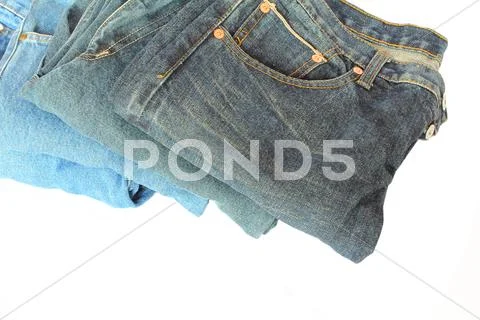 Stack of blue denim clothes Stock Photos