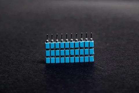 Stack of blue electronic engineering connectors close up Stock Photos