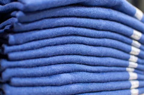 Stack of blue fluffy towels close-up. selective focus Stock Photos
