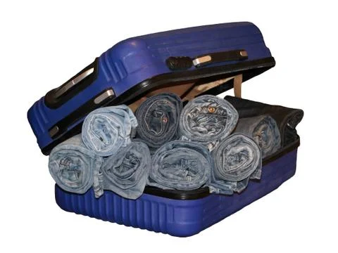 A stack of blue jeans in a blue suitcase, isolated Stock Photos