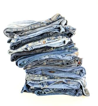 Stack of blue jeans isolate Stock-Fotos
