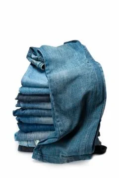 Stack of blue jeans over a white background Stock Photos