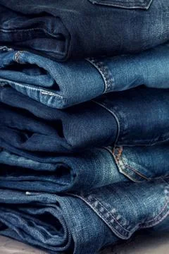 Stack of blue jeans Stock Photos
