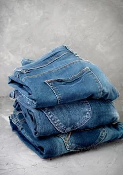 Stack of blue jeans Stock Photos