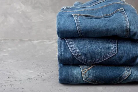 Stack of blue jeans Stock Photos