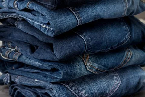 Stack of blue jeans Stock Photos