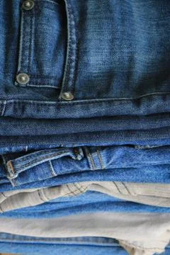Stack of blue jeans Stock Photos
