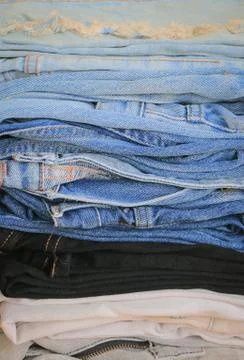 Stack of blue jeans Stock Photos