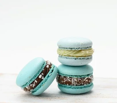 Stack of blue macarons on a white table Stock Photos