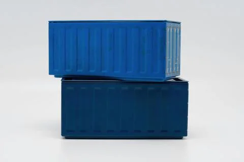 Stack of blue shipping containers against a white background 스톡 사진
