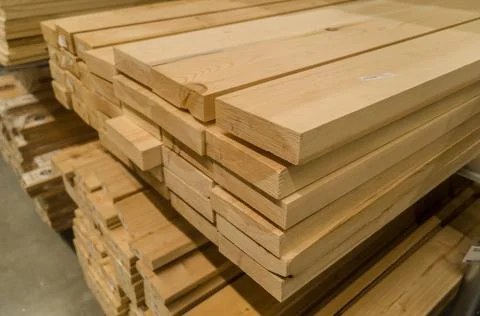 A stack of boards in a hardware store. Wooden products for construction and Stock Photos