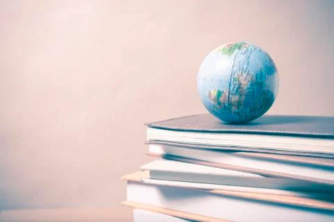 Stack of book and earth ball vintage style Stock Photos