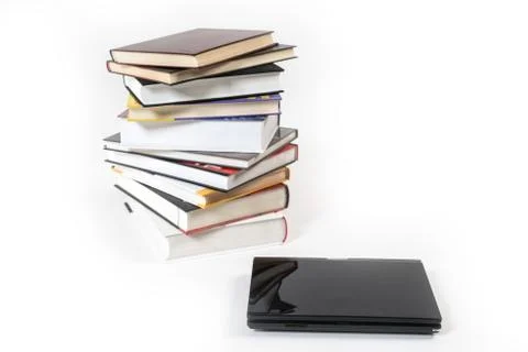 Stack of book and laptop isolated on white Stock Photos