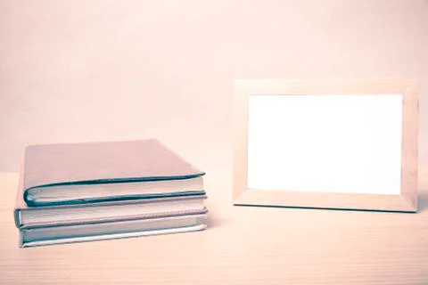 Stack of book and photo frame vintage style Stock Photos