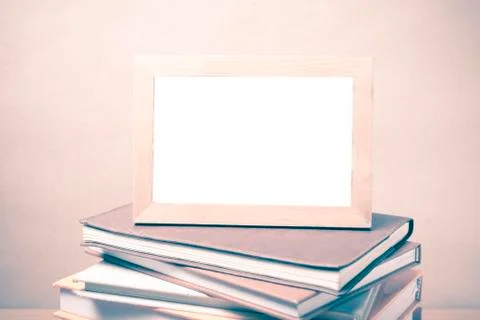 Stack of book and photo frame vintage style Stock Photos