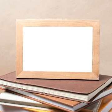 Stack of book and photo frame Stock Photos