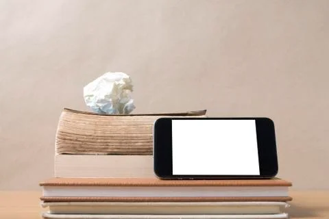 Stack of book and smart phone Stock Photos