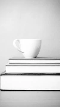 Stack of book with coffee cup black and white color tone style Foto stock