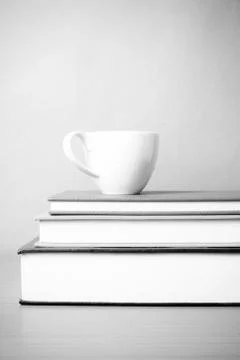 Stack of book with coffee cup black and white color tone style 스톡 사진