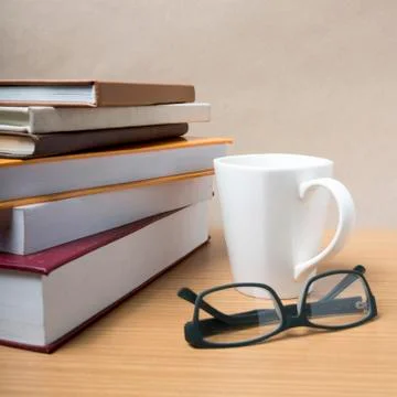 Stack of book with coffee mug Stock Photos